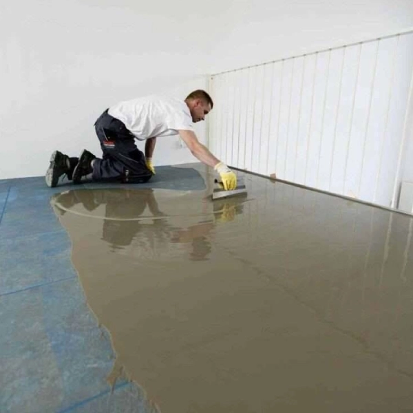 A Man Painting A Floor In Dubai