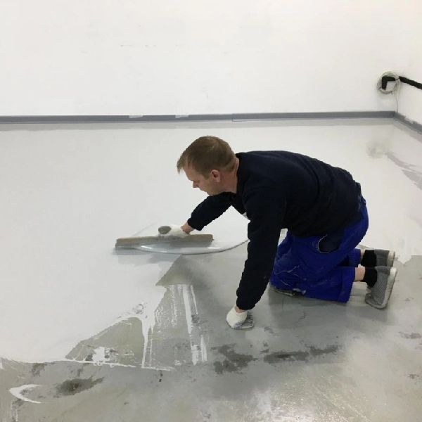 A Man Painting A Floor in UAE